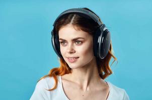 cheerful girl in a white t-shirt wearing headphones joystick technology game photo