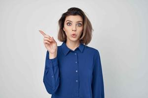 woman in blue shirt wearing glasses fashion cropped view light background photo