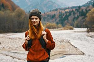 woman travels in the mountains outdoors fresh air beach river landscape mountains photo