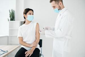 patient in hospital being injected against covid-19 vaccination epidemic photo