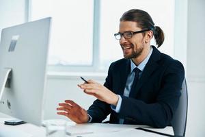 male manager work in front of a computer documents Lifestyle photo