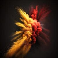 Red and yellow powder explosion on black photo