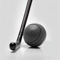 hockey ball and hockey stick on white background photo