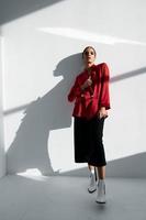 stylish woman in red blazer and trousers fashionable autumn shoes suit classic portrait photo