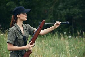 Military woman reloading gun side view weapons photo