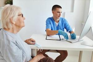 elderly woman at the doctor's appointment health care photo