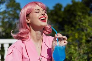 cheerful woman with pink hair summer cocktail refreshing drink Drinking alcohol photo