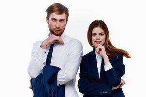 man and woman standing side by side cropped view light background photo