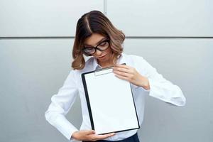 cheerful woman in white shirt documents office official businesswoman photo