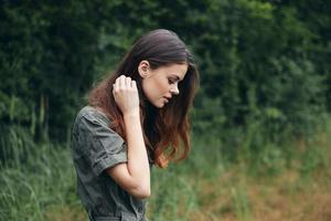 Woman in the forest Looks down a walk lifestyle fresh air photo