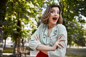 cheerful woman walking in the park trees leisure lifestyle photo