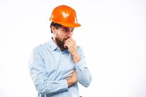 man in work uniform orange helmet professional safety industry construction photo