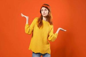 woman in yellow sweater with red headband modern style hipster accessories photo