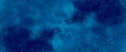 blue watercolor and paper texture. beautiful dark gradient hand drawn by brush grunge background. watercolor wash aqua painted texture close up, grungy design. blue nebula sparkle star universe. photo