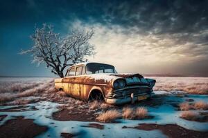 an old rusted out car in a snowy field a stock photo