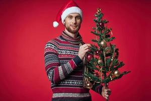 cute man in christmas clothes christmas tree toys lifestyle photo