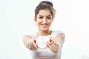 cheerful woman with jar of cream skin care dermatology therapy photo