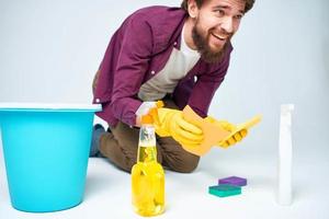 man wearing rubber gloves cleaning interior service professional photo