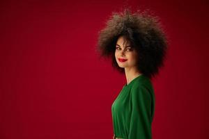 pretty woman in green dress afro hairstyle studio photo