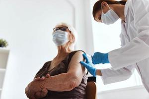female doctor immunization safety drug injection photo