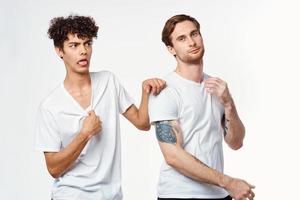 emotional men in white t-shirts antics fun isolated background photo