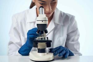 woman scientist laboratory microscope research biotechnology photo