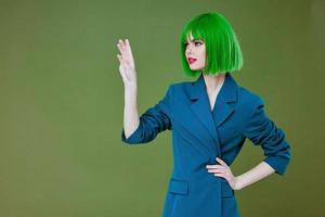 Positive young woman attractive look green wig blue jacket posing color background unaltered photo