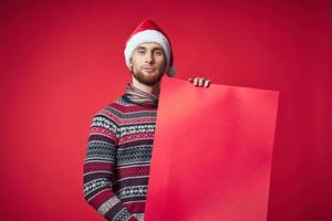 Cheerful man in New Year's clothes advertising copy space studio posing photo