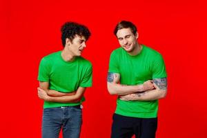 two man holding his neck emotions discontent red background photo