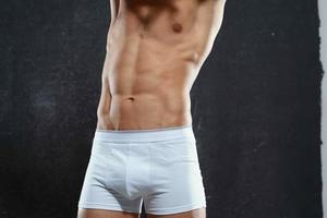 man in white underpants pumped up body fitness exercise bodybuilding photo