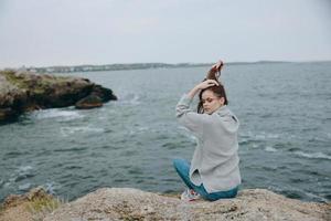 beautiful woman beach tourism cloudy weather stone coast unaltered photo