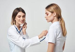 professional doctor with stethoscope heartbeat patient health work photo