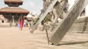 Moving close up shot of poles supporting damaged buildings on Durbar square, Bhaktapur, Nepal video