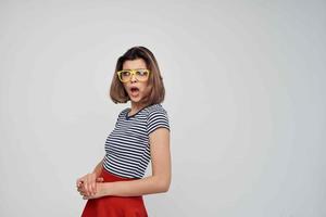 pretty woman in yellow glasses in red skirt fashion summer photo