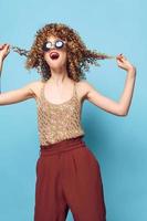 Cheerful woman Fun Red lipstick trendy clothes charm studio curly hair photo