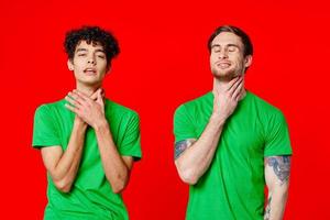 two man holding his neck emotions discontent red background photo