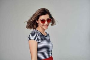 pretty woman in a striped T-shirt posing Studio photo