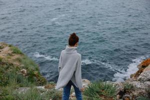 pretty woman sweaters cloudy sea admiring nature female relaxing photo