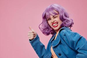 Beautiful fashionable girl in denim jacket purple hair glamor makeup color background unaltered photo