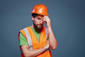 A man in a working uniform a professional construction close-up photo