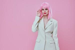 Beautiful fashionable girl attractive look white blazer pink wig studio model unaltered photo