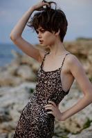 woman in dress modern nature luxury posing freedom elegance photo