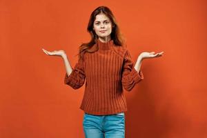 cheerful woman in red sweater posing fashion decoration photo