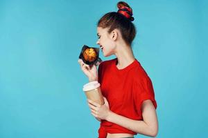 woman with cup of coffee and cupcake in hands breakfast diet food photo