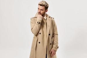 man in beige coat autumn style studio cropped view photo