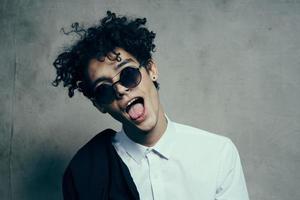 stylish guy with curly hair emotions wide open mouth portrait model photo