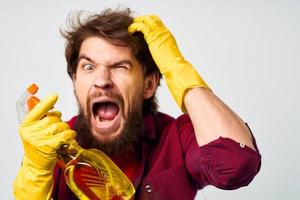 Cleaner with detergent in rubber gloves hands professional service rendering photo