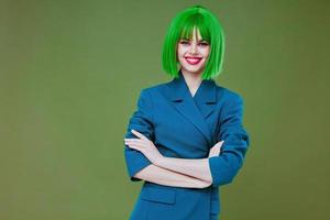 Young woman attractive look green wig blue jacket posing color background unaltered photo