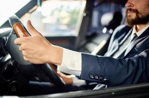 businessmen in a suit in a car a trip to work self confidence photo