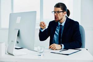 The man in a suit with glasses self-confidence work computer photo